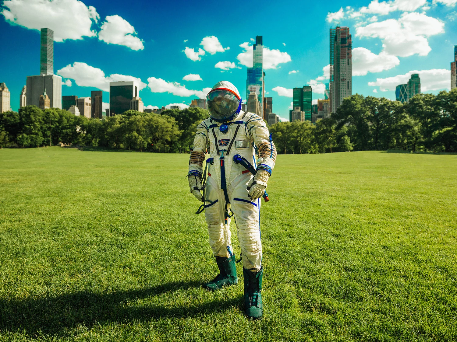 A cinematic portrait of a person in a white spacesuit in a park beneath the city skyline
